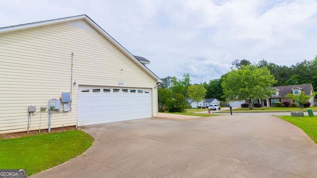 view of side of property featuring a garage