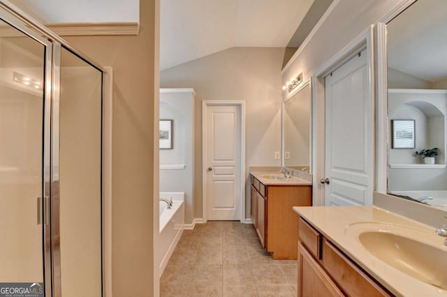 2505 Thackery Ct, Cumming, GA 30041 - full bath featuring vaulted ceiling, a shower stall, a bath, tile patterned floors, and two vanities