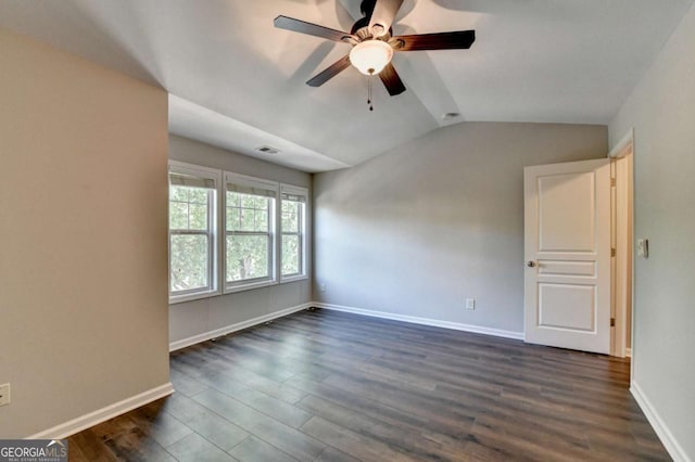 2505 Thackery Ct, Cumming, GA 30041 - spare room featuring vaulted ceiling, ceiling fan, dark wood-style floors, and baseboards