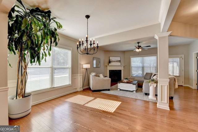 2505 Thackery Ct, Cumming, GA 30041 - living area featuring ornate columns, wood finished floors, plenty of natural light, and crown molding