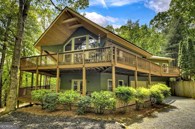 back of house featuring a deck