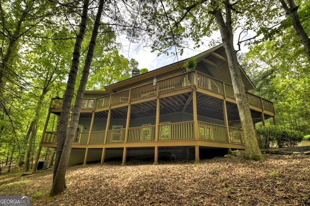 rear view of house with a deck