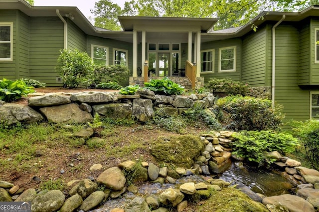back of house with covered porch