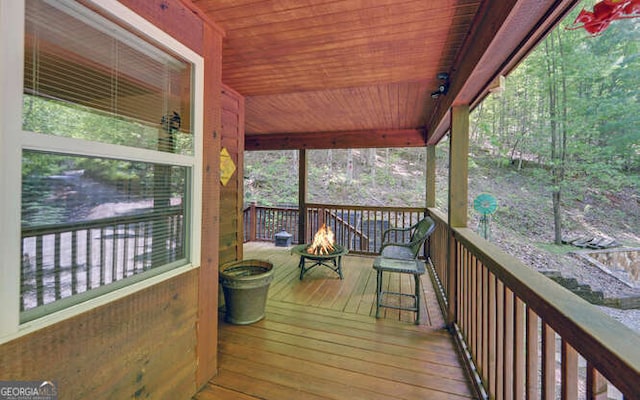 deck with an outdoor fire pit
