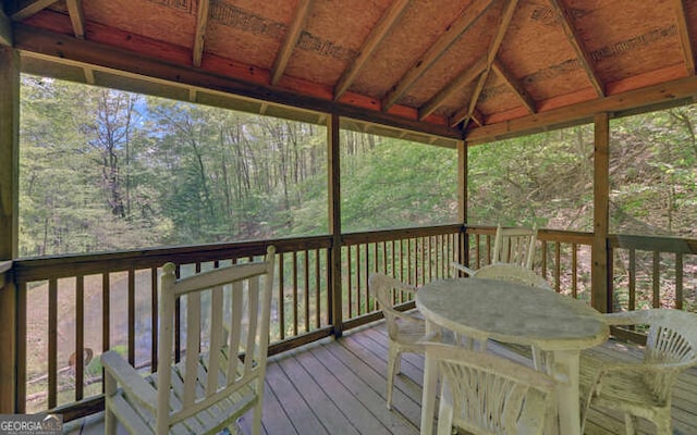 wooden deck with outdoor dining space