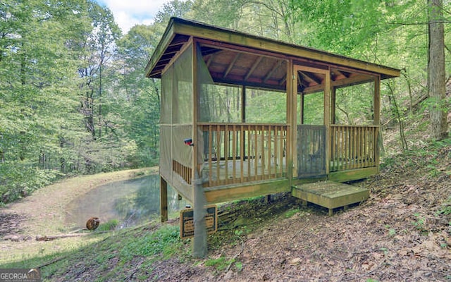deck featuring a forest view