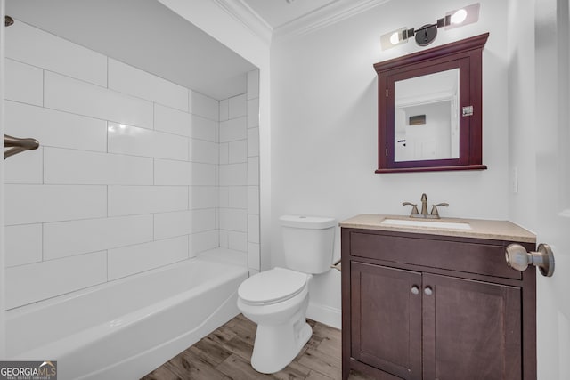 full bath with crown molding, toilet, baseboards, wood finished floors, and vanity