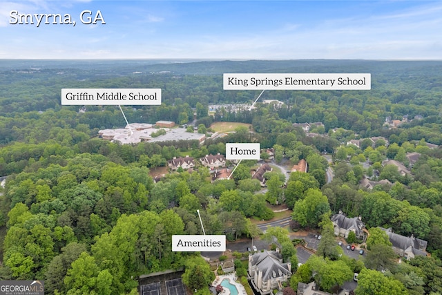drone / aerial view of a heavily wooded area