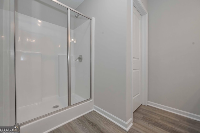 2871 Fareed, Douglasville, GA 30135 - full bathroom featuring wood finished floors, baseboards, and a stall shower