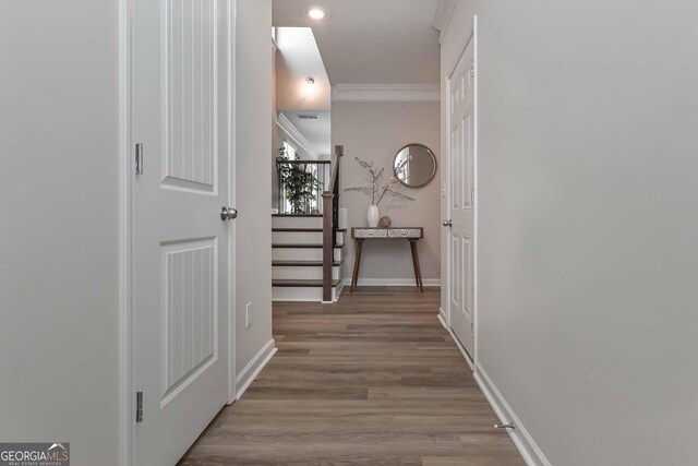 2871 Fareed, Douglasville, GA 30135 - hallway featuring crown molding, stairs, baseboards, wood finished floors, and recessed lighting