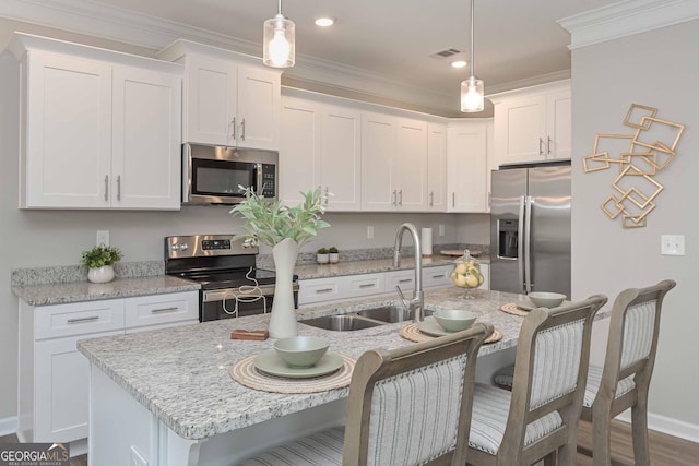 2871 Fareed, Douglasville, GA 30135 - kitchen featuring appliances with stainless steel finishes, a sink, crown molding, baseboards, and white cabinets