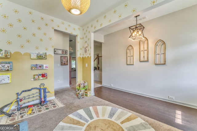 214 Willowbrook Way SE, Calhoun, GA 30701 - rec room featuring baseboards, a chandelier, wood finished floors, and wallpapered walls