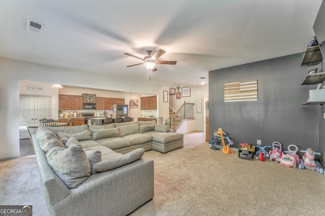 214 Willowbrook Way SE, Calhoun, GA 30701 - living area with light carpet, stairway, and ceiling fan