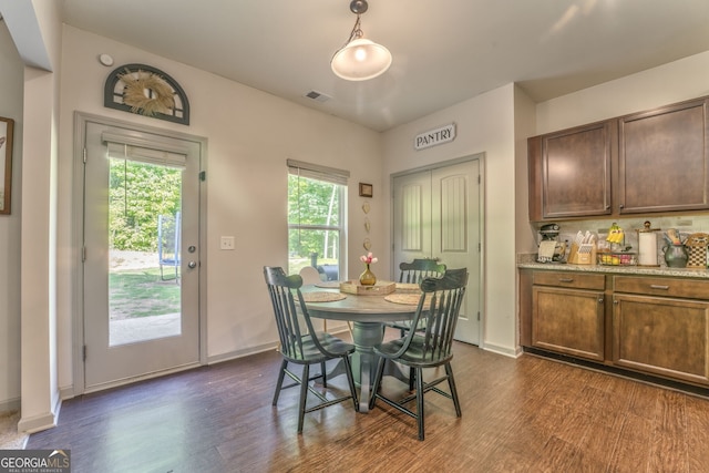 214 Willowbrook Way SE, Calhoun, GA 30701 - dining room with dark wood-style floors and baseboards