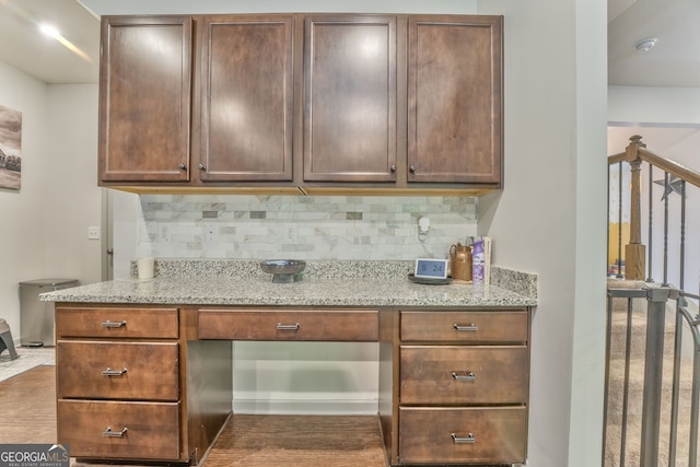 214 Willowbrook Way SE, Calhoun, GA 30701 - kitchen with decorative backsplash, light stone counters, and dark wood-style floors