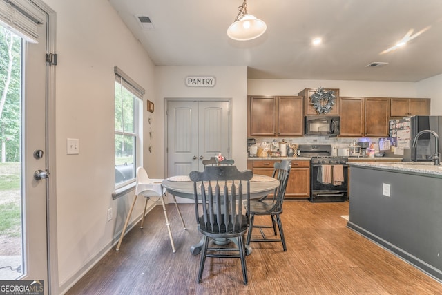 214 Willowbrook Way SE, Calhoun, GA 30701 - dining space featuring dark wood finished floors and healthy amount of natural light