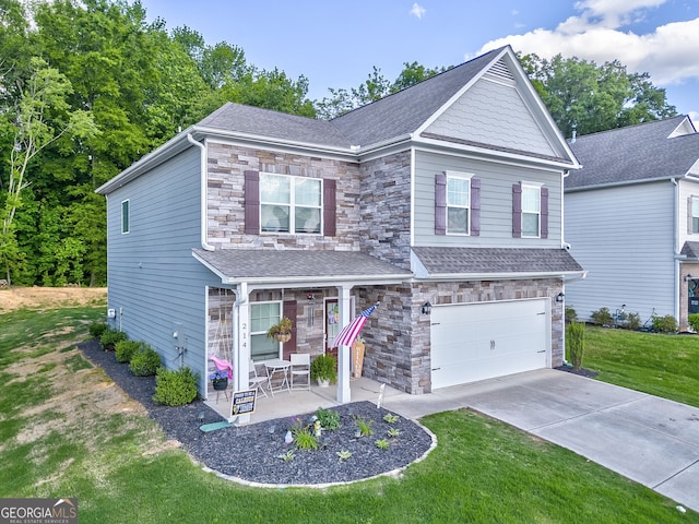 214 Willowbrook Way SE, Calhoun, GA 30701 - craftsman-style home with stone siding, an attached garage, a front lawn, and concrete driveway