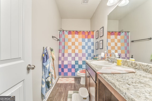 214 Willowbrook Way SE, Calhoun, GA 30701 - full bath with vanity, wood finished floors, toilet, and a shower with shower curtain