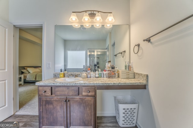214 Willowbrook Way SE, Calhoun, GA 30701 - ensuite bathroom with a stall shower, vanity, and wood finished floors