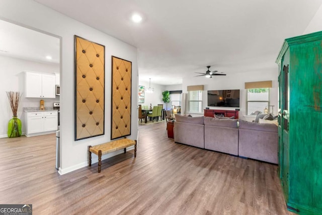426 Samara Ct, Fairburn, GA 30213 - living room featuring a ceiling fan, light wood-type flooring, baseboards, and recessed lighting