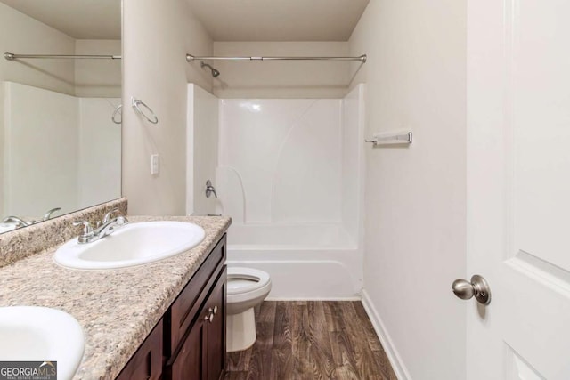 255 Dublin Way, Dallas, GA 30132 - bathroom featuring wood finished floors, double vanity, and bathtub / shower combination