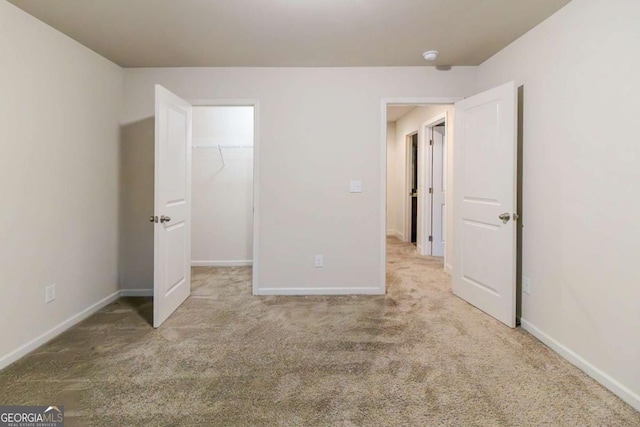 255 Dublin Way, Dallas, GA 30132 - unfurnished bedroom with carpet floors, a spacious closet, and a closet