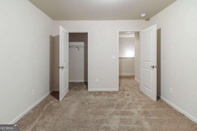 255 Dublin Way, Dallas, GA 30132 - unfurnished bedroom with carpet, baseboards, and a closet