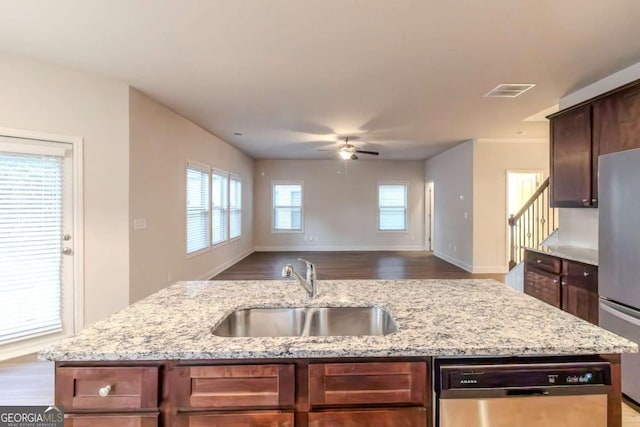 255 Dublin Way, Dallas, GA 30132 - kitchen featuring appliances with stainless steel finishes, a sink, ceiling fan, open floor plan, and an island with sink