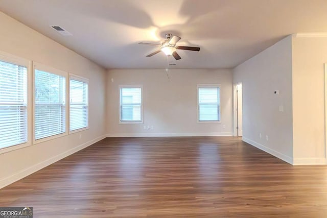 255 Dublin Way, Dallas, GA 30132 - empty room featuring a ceiling fan, plenty of natural light, and wood finished floors