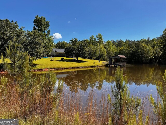 water view featuring a heavily wooded area