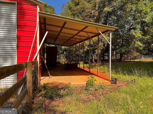 view of parking / parking lot with fence