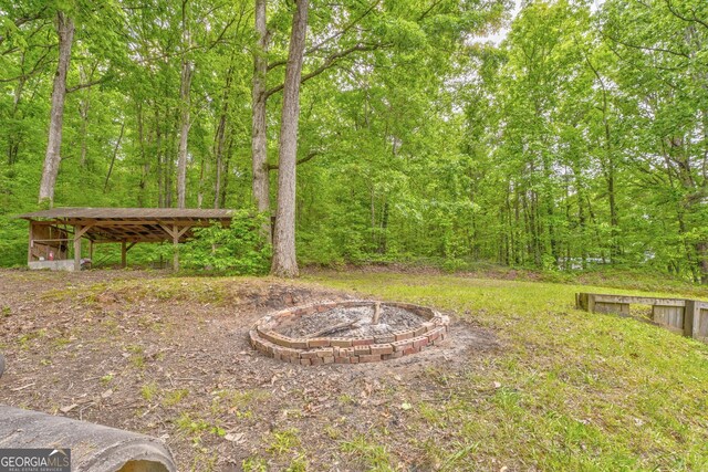 2290 Old Federal Rd, Chatsworth, GA 30705 - view of yard featuring an outdoor fire pit and a wooded view