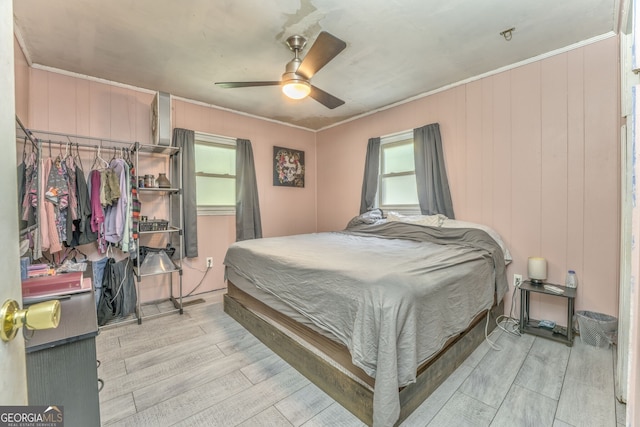 2290 Old Federal Rd, Chatsworth, GA 30705 - bedroom featuring light wood-style flooring, multiple windows, ornamental molding, and ceiling fan