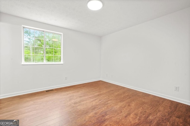 1355 Tucker Woods Dr, Norcross, GA 30093 - spare room featuring wood finished floors and baseboards
