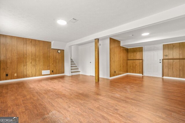 1355 Tucker Woods Dr, Norcross, GA 30093 - finished basement with wood walls, wood finished floors, stairway, and baseboards