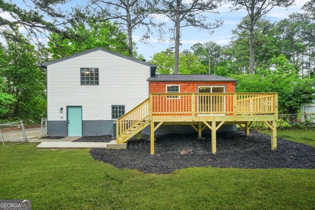 1355 Tucker Woods Dr, Norcross, GA 30093 - back of property with a deck, stairs, and view of scattered trees