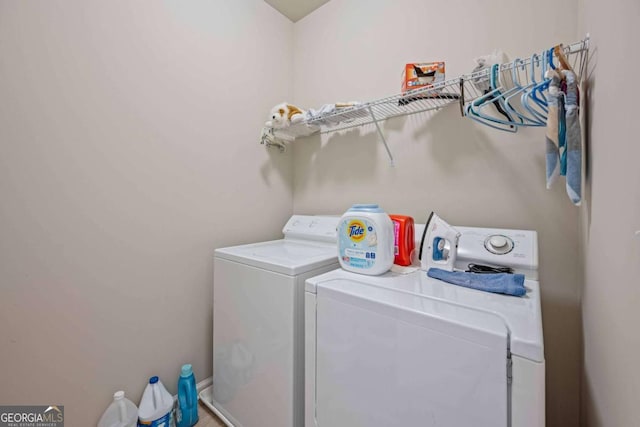 clothes washing area with washer and dryer
