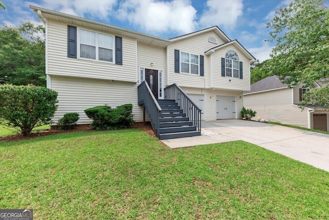 2880 Field Spring Dr, Lithonia, GA 30058 - bi-level home with concrete driveway, an attached garage, and a front yard