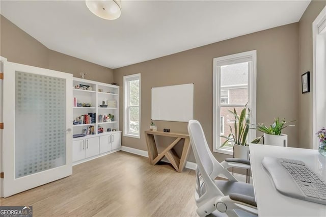 1420 Cortez Ln NE, Atlanta, GA 30319 - home office featuring light wood finished floors and baseboards