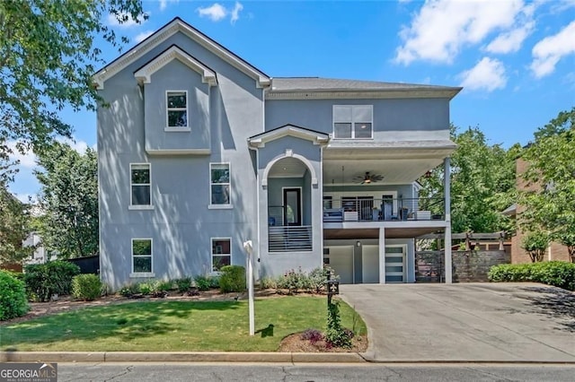 1420 Cortez Ln NE, Atlanta, GA 30319 - traditional-style home with a garage, stucco siding, ceiling fan, a front lawn, and a balcony