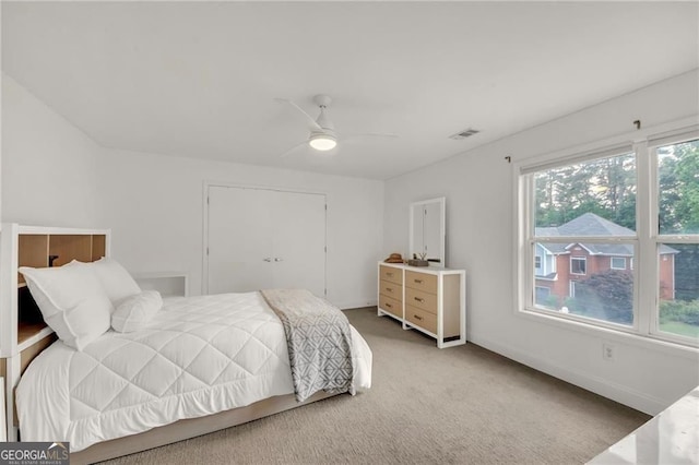 1420 Cortez Ln NE, Atlanta, GA 30319 - bedroom with light carpet, multiple windows, and ceiling fan