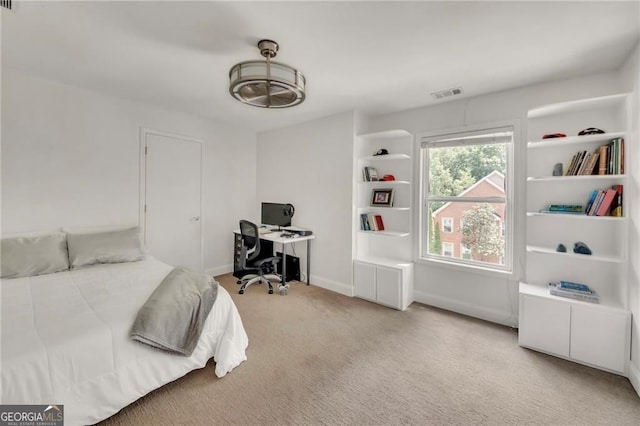 1420 Cortez Ln NE, Atlanta, GA 30319 - carpeted bedroom with an office area and baseboards