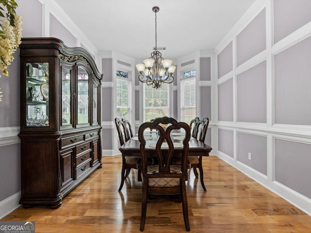 124 Belford Way, Locust Grove, GA 30233 - dining space featuring a chandelier, light wood-type flooring, and crown molding