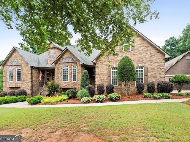 124 Belford Way, Locust Grove, GA 30233 - craftsman inspired home featuring a front yard, brick siding, and roof with shingles
