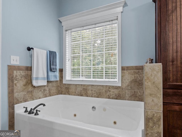 124 Belford Way, Locust Grove, GA 30233 - bathroom with healthy amount of natural light and a whirlpool tub