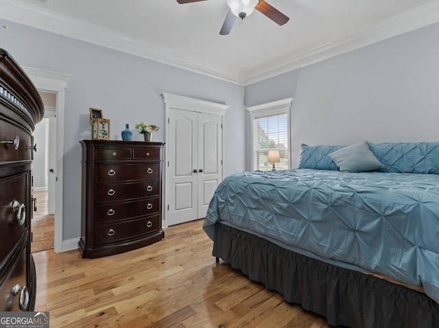 124 Belford Way, Locust Grove, GA 30233 - bedroom with light wood-style floors, crown molding, ceiling fan, and a closet