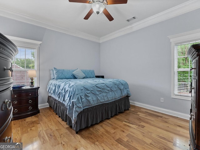 124 Belford Way, Locust Grove, GA 30233 - bedroom featuring multiple windows, light wood-type flooring, crown molding, and a ceiling fan