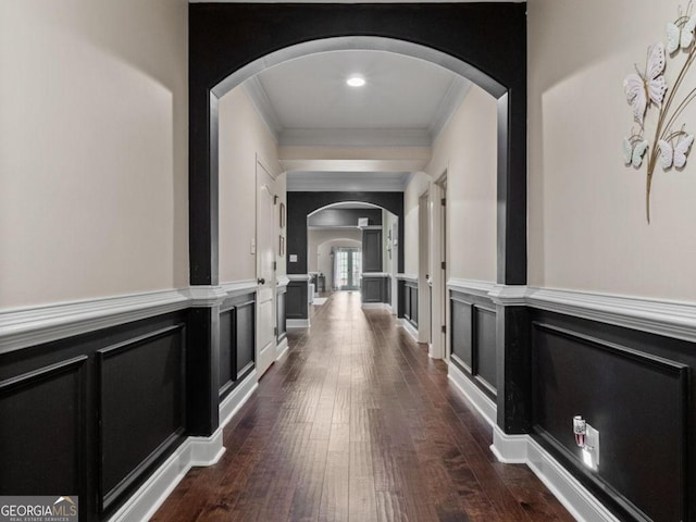 124 Belford Way, Locust Grove, GA 30233 - corridor with arched walkways, crown molding, dark wood finished floors, and a wainscoted wall