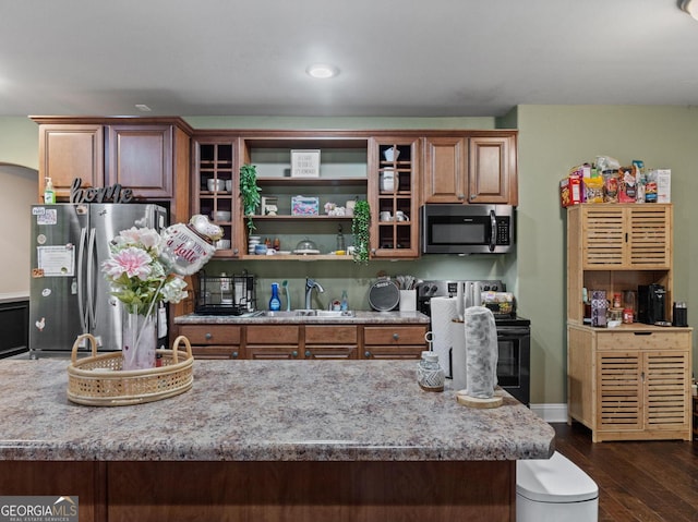 124 Belford Way, Locust Grove, GA 30233 - kitchen featuring stainless steel appliances, dark wood finished floors, brown cabinets, open shelves, and recessed lighting