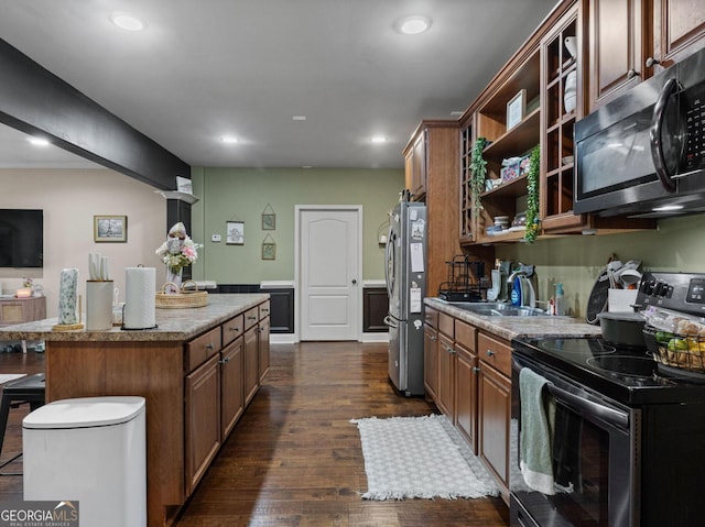 124 Belford Way, Locust Grove, GA 30233 - kitchen with stainless steel appliances, open shelves, a kitchen island, dark wood-style floors, and recessed lighting
